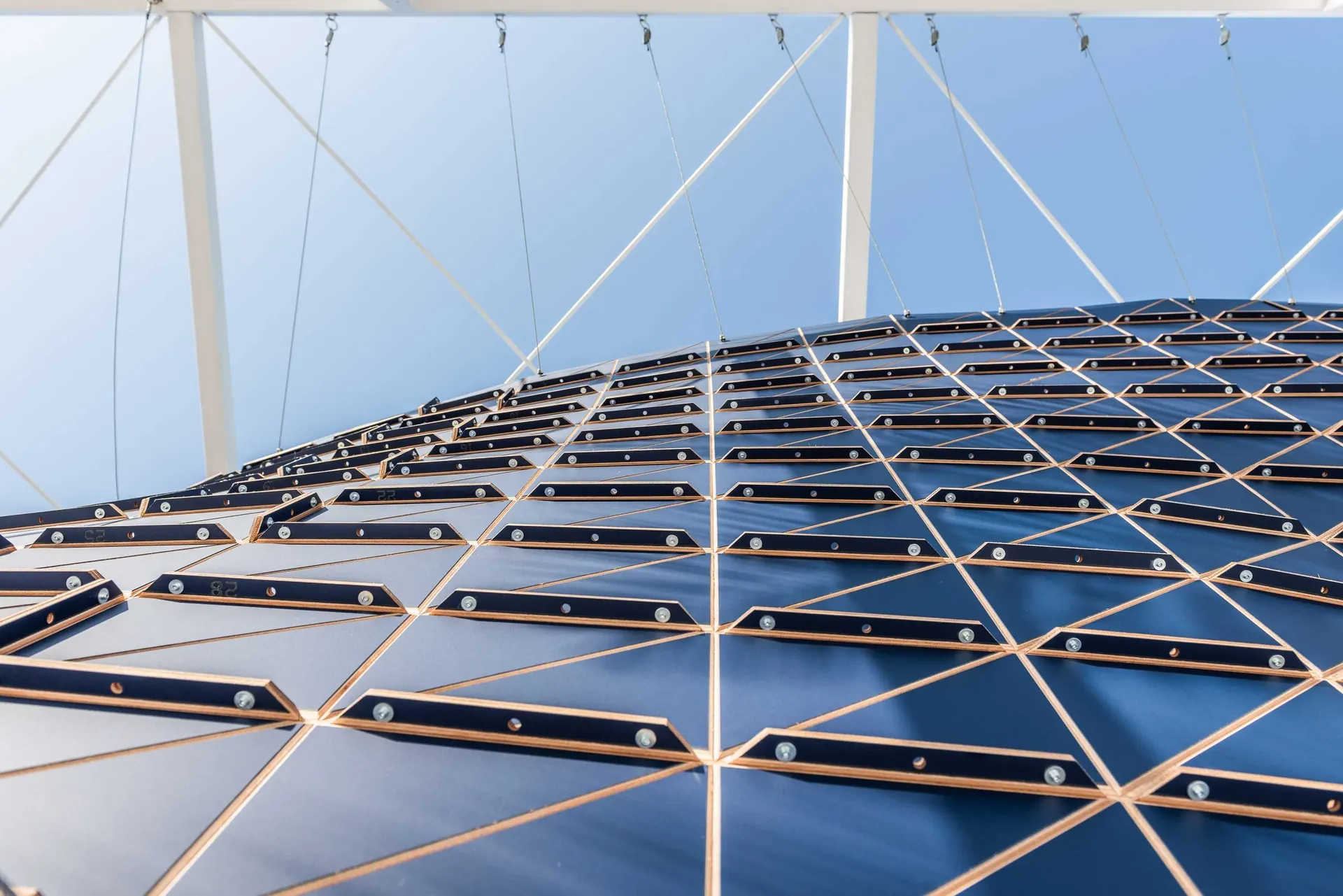 Timber surface hung on cables, Dubai Design Week